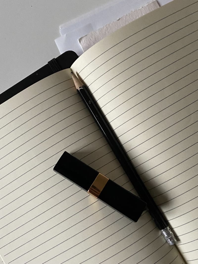 Open notebook with pen beside it symbolizing the creation of legal website pages for a small business website