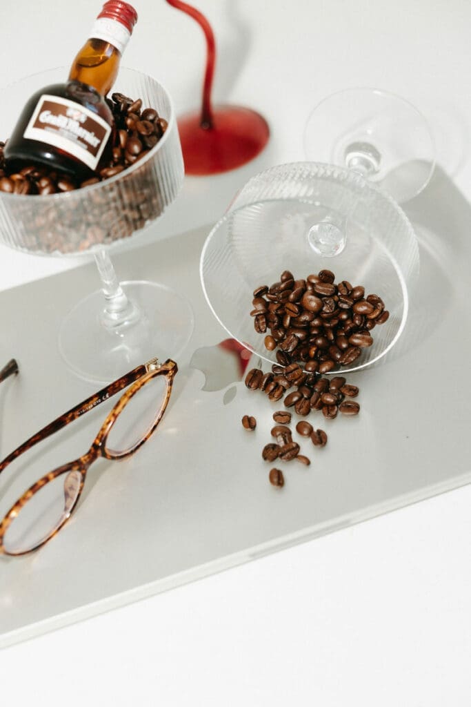 Coffee beans, glassware, and styled brand elements arranged for a creative brand photoshoot.