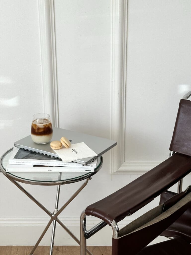 Website launch checklist inspiration with laptop, iced coffee, and clean workspace styled for planning